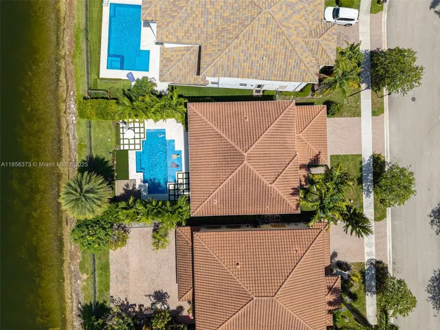 $1,310,000 | 9709 Blue Isle Bay, Parkland, FL 33076