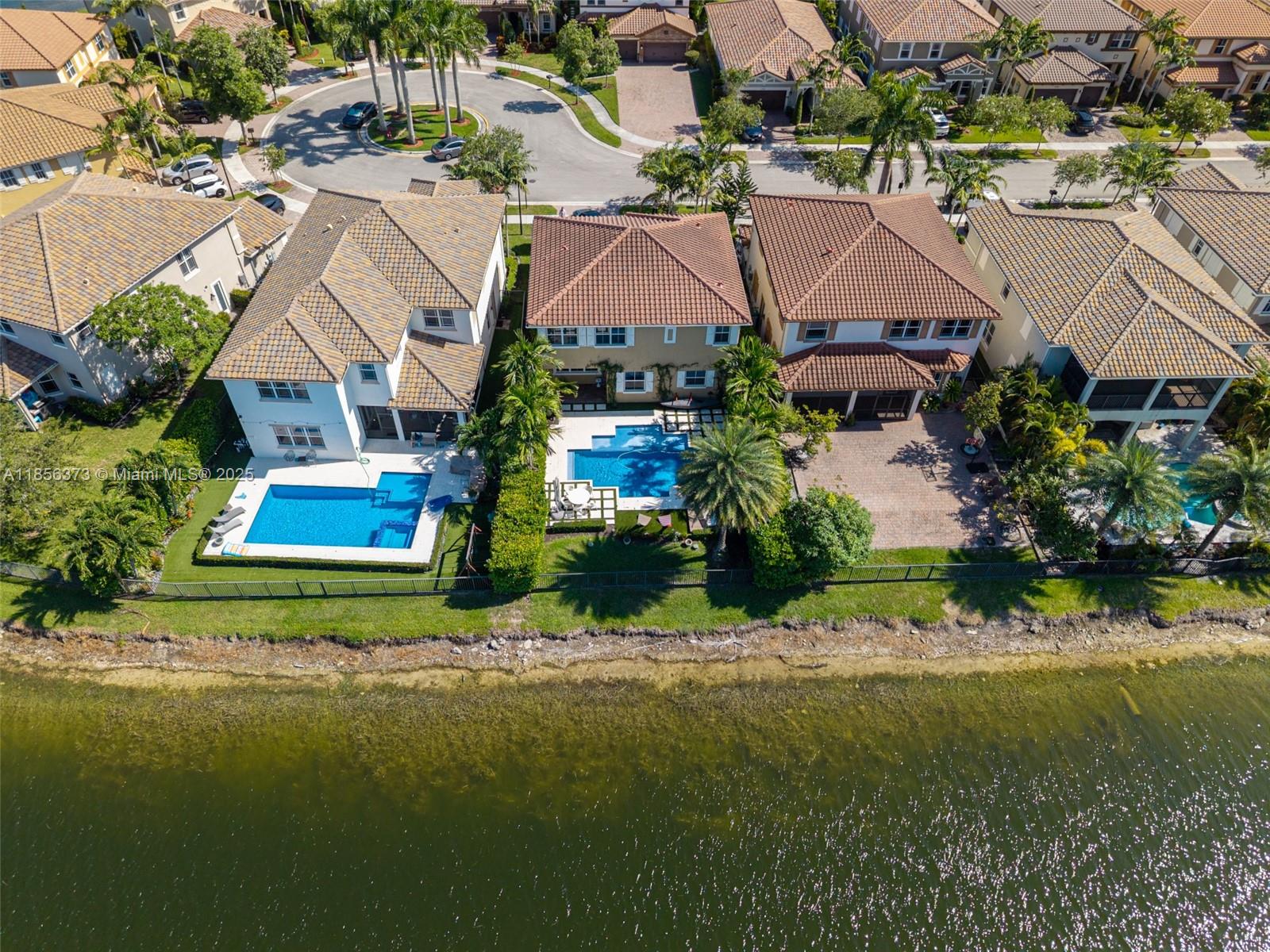 9709 Blue Isle Bay Parkland, FL 33076 - Photo 69 of 75 an aerial view of residential houses with outdoor space and street view