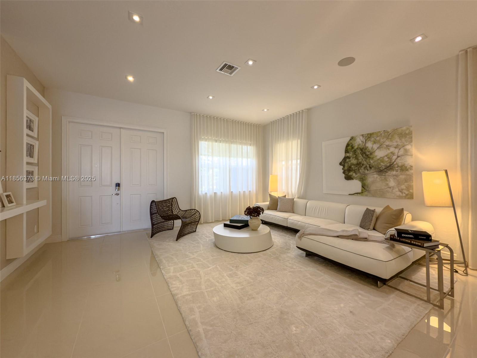 9709 Blue Isle Bay Parkland, FL 33076 - Photo 7 of 75 a living room with furniture and a large window