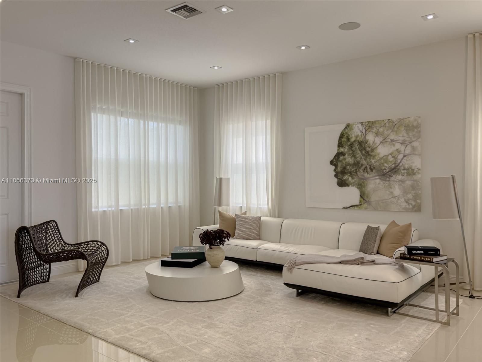 9709 Blue Isle Bay Parkland, FL 33076 - Photo 9 of 75 a living room with furniture and a large window