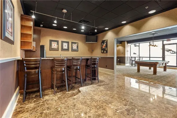 a view of a chairs and table in a room