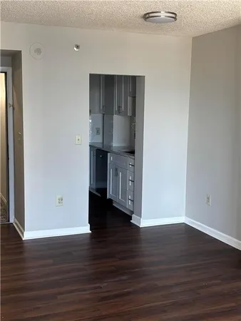 a view of kitchen with wooden floor