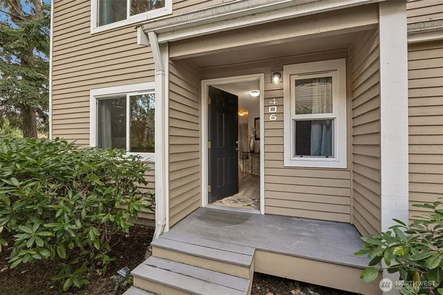 a view of a house with potted plants