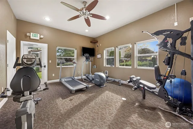 a room with gym equipment and a large window