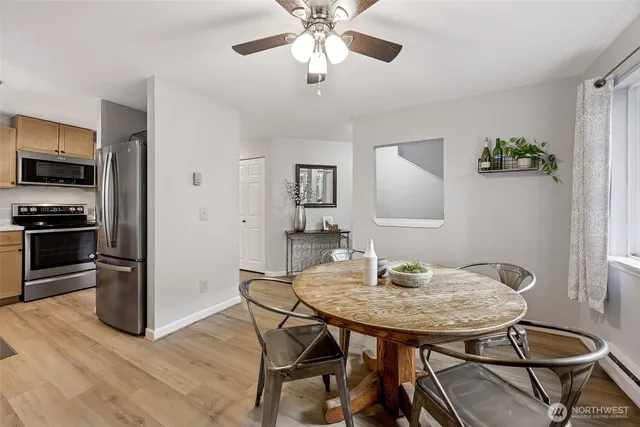 a view of a dining room with furniture and wooden floor