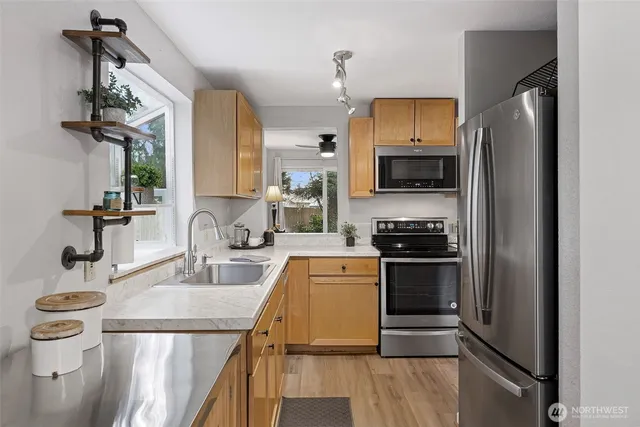 a kitchen with a sink and a refrigerator