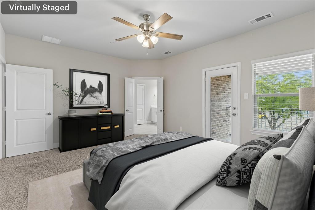 525 Teton Street Allen, TX 75002 - Photo 14 of 31 a bedroom with a bed and a chandelier