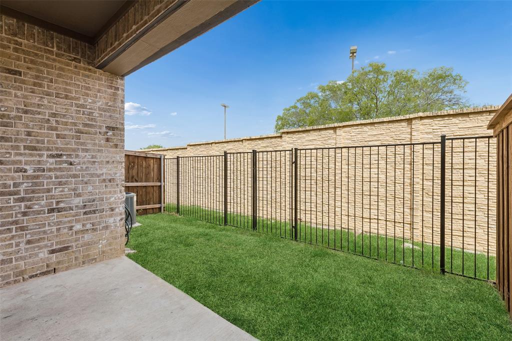 525 Teton Street Allen, TX 75002 - Photo 22 of 31 a view of a backyard with a garden