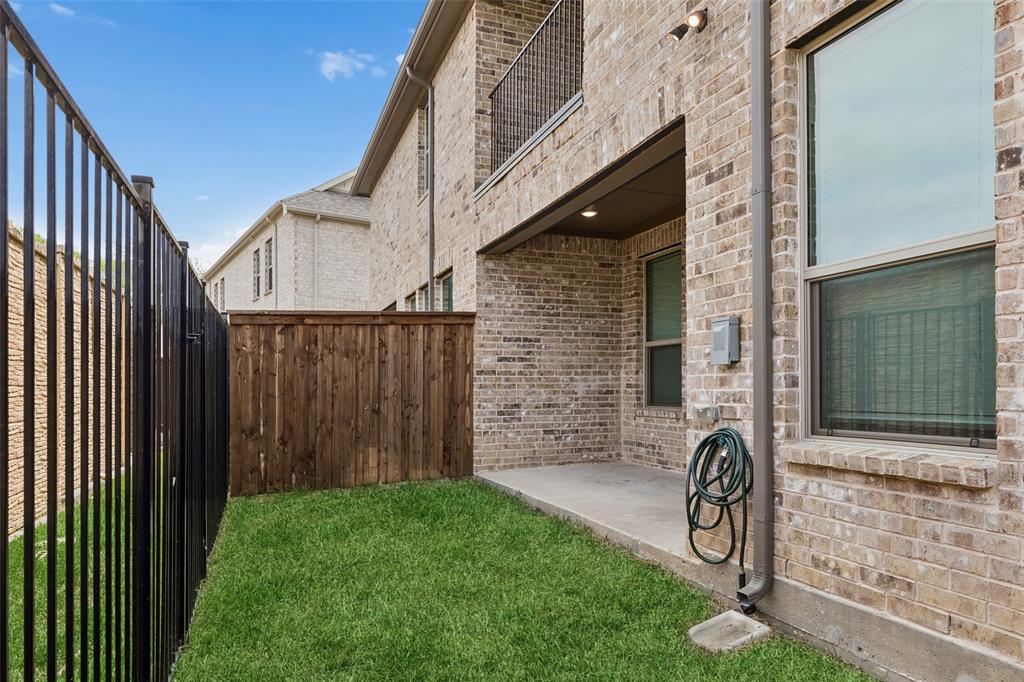 525 Teton Street Allen, TX 75002 - Photo 23 of 31 a front view of a house with a garden