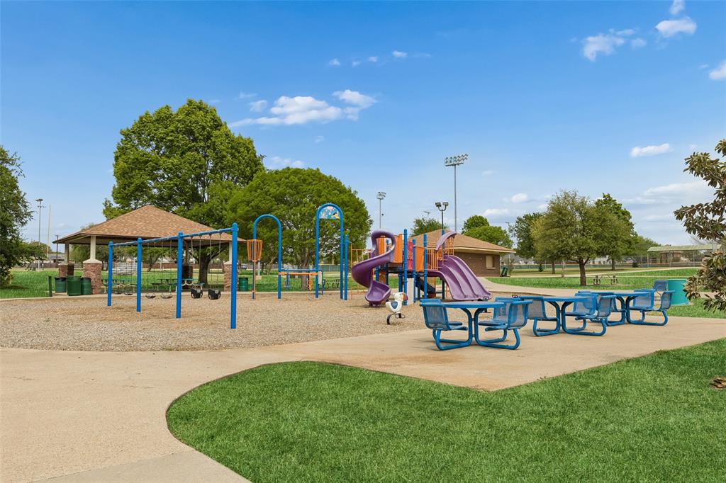 525 Teton Street Allen, TX 75002 - Photo 30 of 31 a childrens park with lots of swings and slides