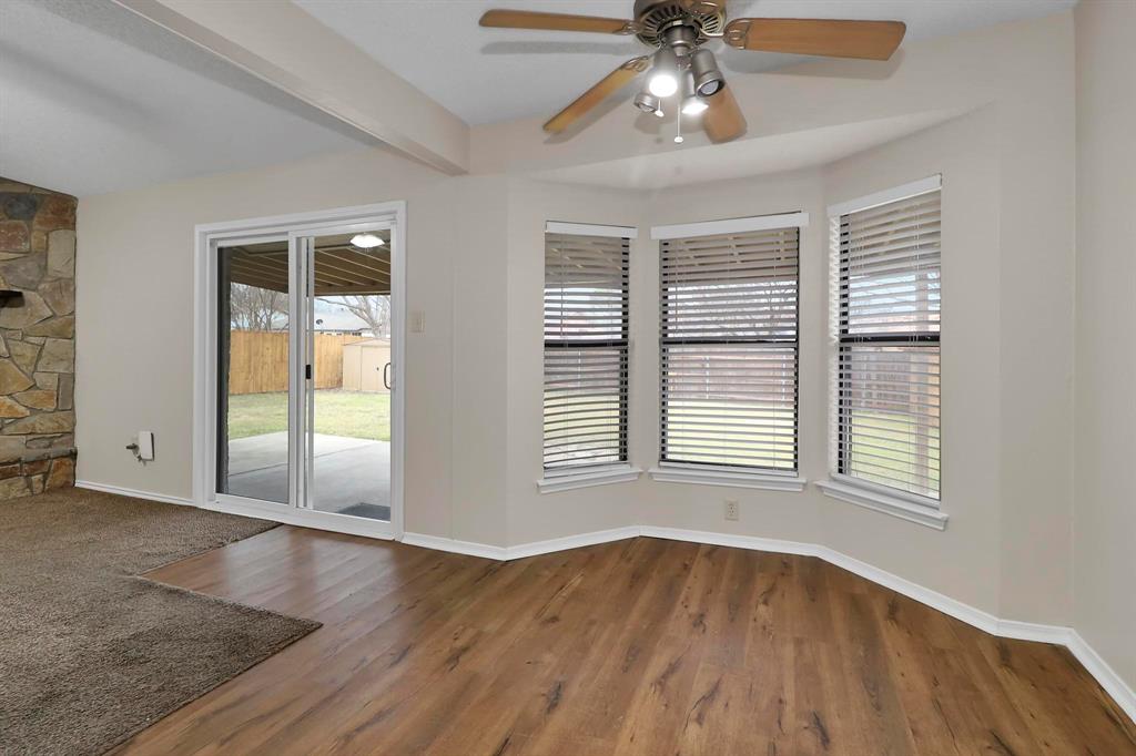 6632 Valley View Drive Watauga, TX 76148 - Photo 13 of 18 a view of an empty room with wooden floor and a window