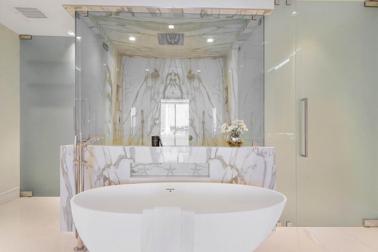 725 South Ocean Boulevard, Unit 202 Boca Raton, FL 33432 - Photo 14 of 57 a bath tub sitting in a bathroom