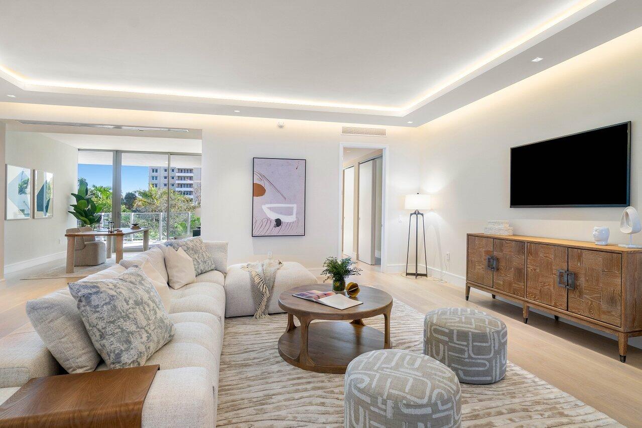 725 South Ocean Boulevard, Unit 202 Boca Raton, FL 33432 - Photo 17 of 57 a living room with furniture and a flat screen tv