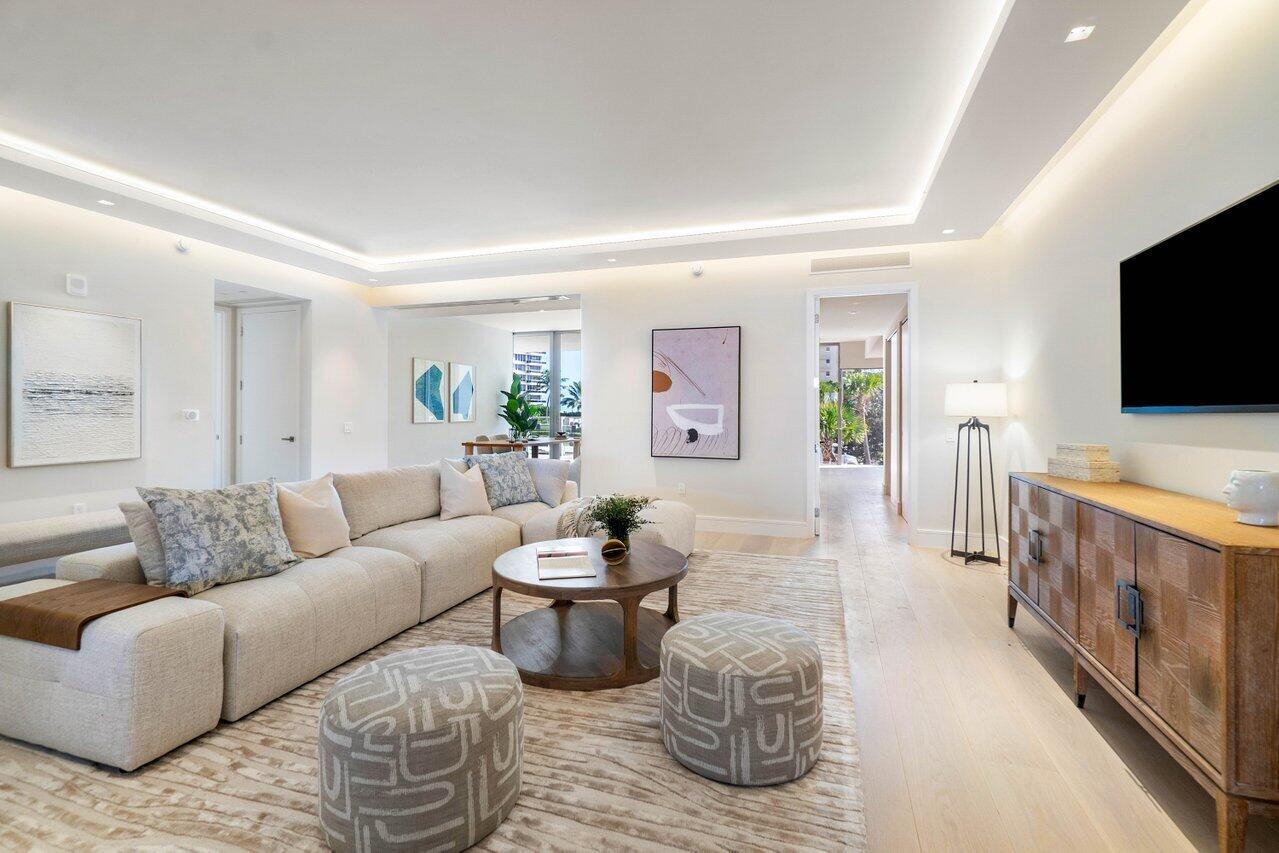 725 South Ocean Boulevard, Unit 202 Boca Raton, FL 33432 - Photo 18 of 57 a living room with furniture and a flat screen tv