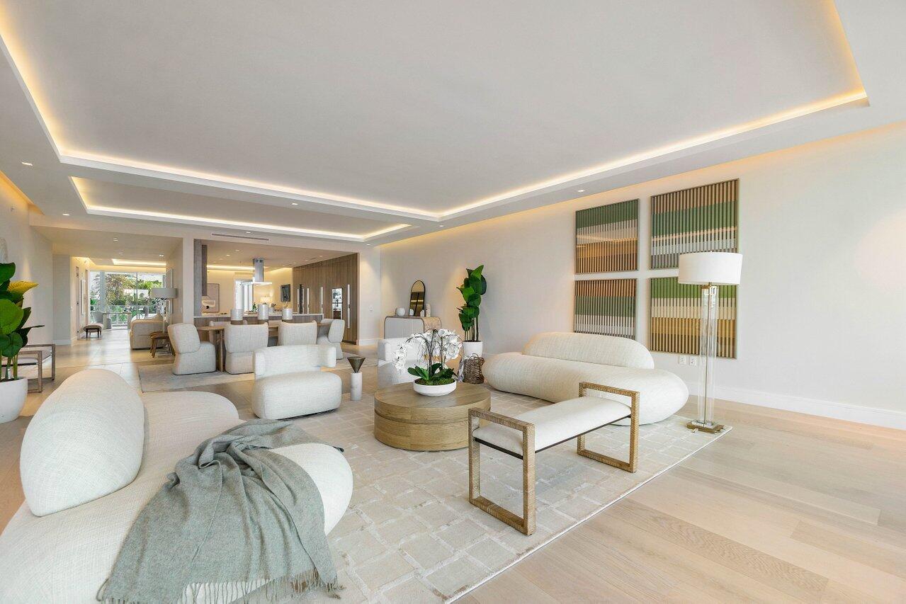 725 South Ocean Boulevard, Unit 202 Boca Raton, FL 33432 - Photo 22 of 57 a living room with furniture and a large window