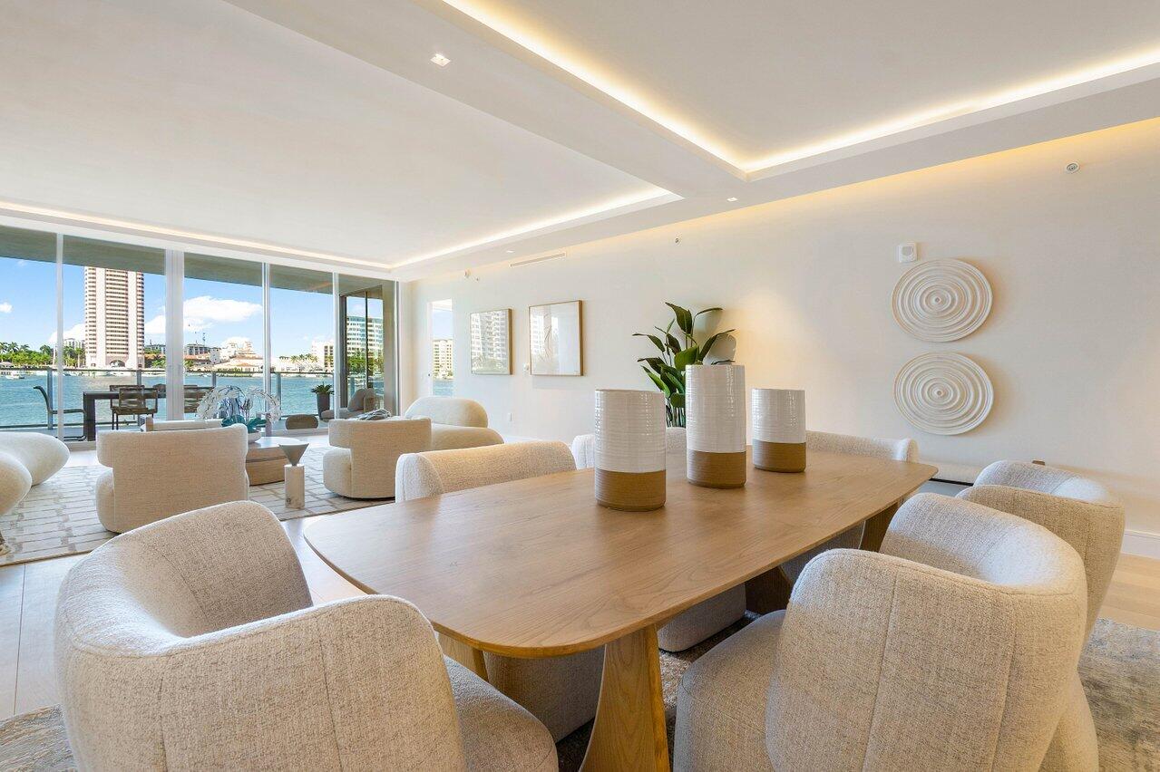 725 South Ocean Boulevard, Unit 202 Boca Raton, FL 33432 - Photo 25 of 57 a living room with furniture and a table