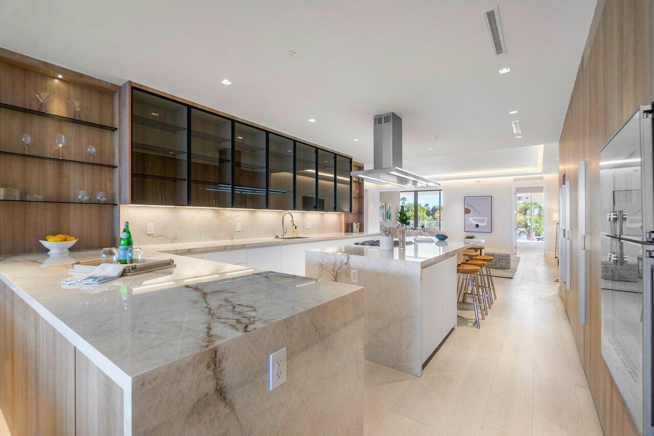 725 South Ocean Boulevard, Unit 202 Boca Raton, FL 33432 - Photo 30 of 57 a dining hall with stainless steel appliances granite countertop a granite counter tops and a view of living room