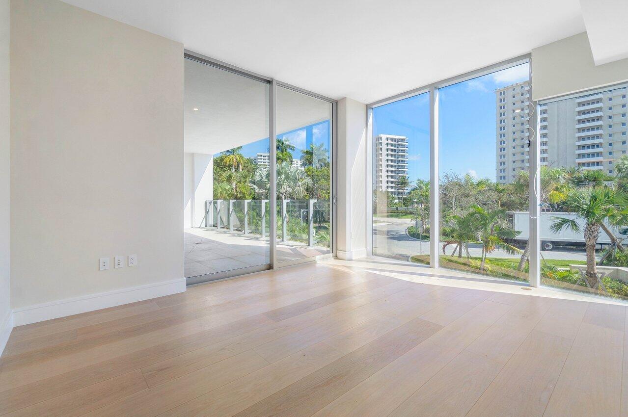 725 South Ocean Boulevard, Unit 202 Boca Raton, FL 33432 - Photo 35 of 57 a view of an empty room with wooden floor and a window