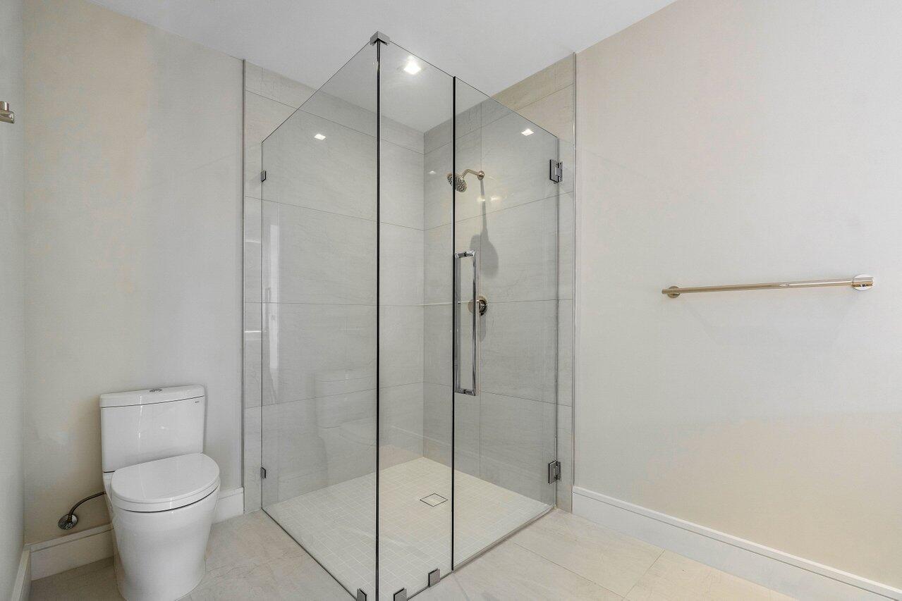 725 South Ocean Boulevard, Unit 202 Boca Raton, FL 33432 - Photo 37 of 57 a bathroom with a shower and toilet