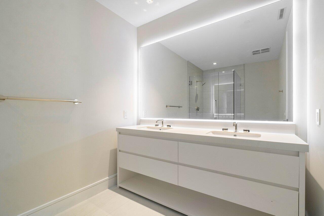 725 South Ocean Boulevard, Unit 202 Boca Raton, FL 33432 - Photo 38 of 57 a bathroom with a sink and a mirror