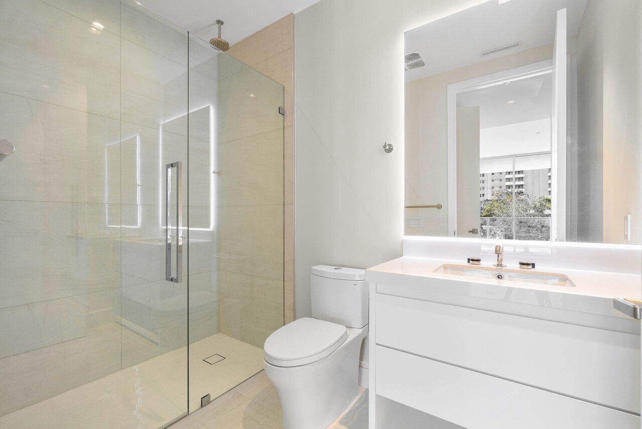 725 South Ocean Boulevard, Unit 202 Boca Raton, FL 33432 - Photo 40 of 57 a bathroom with a sink toilet and shower