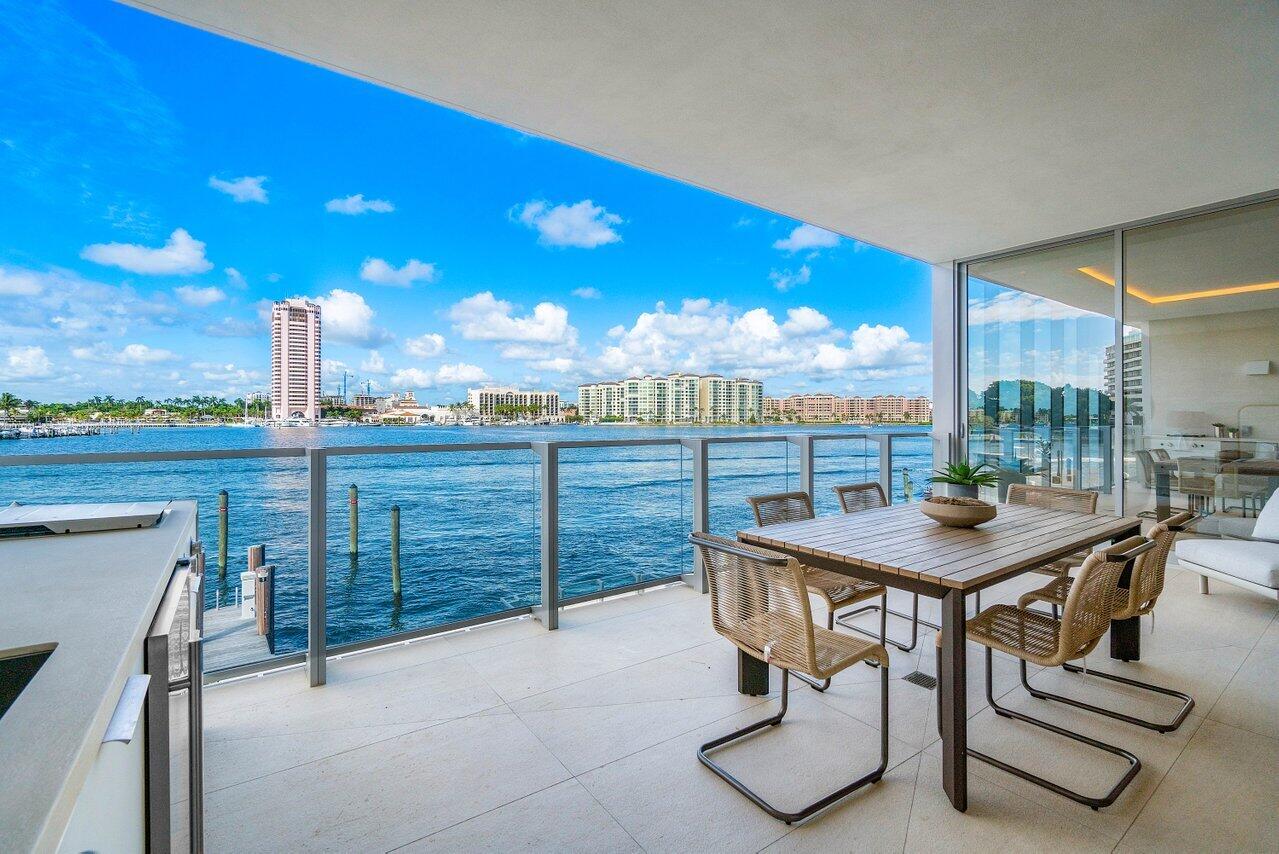 725 South Ocean Boulevard, Unit 202 Boca Raton, FL 33432 - Photo 4 of 57 a view of a terrace with furniture and city view