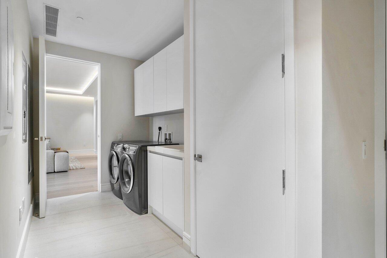 725 South Ocean Boulevard, Unit 202 Boca Raton, FL 33432 - Photo 41 of 57 a view of utility room and washer and dryer