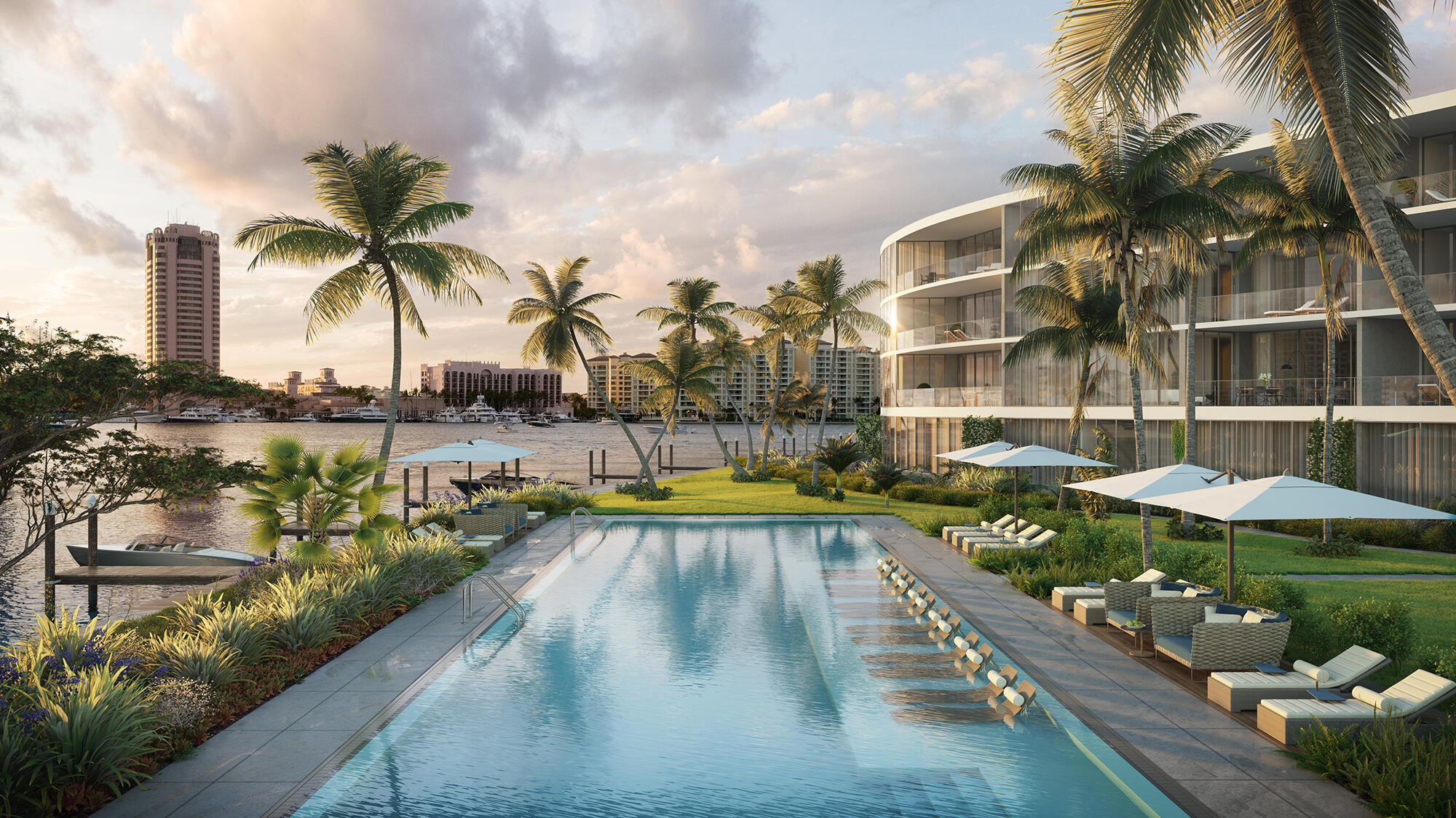 725 South Ocean Boulevard, Unit 202 Boca Raton, FL 33432 - Photo 44 of 57 a view of a swimming pool with a lawn chairs under an umbrella
