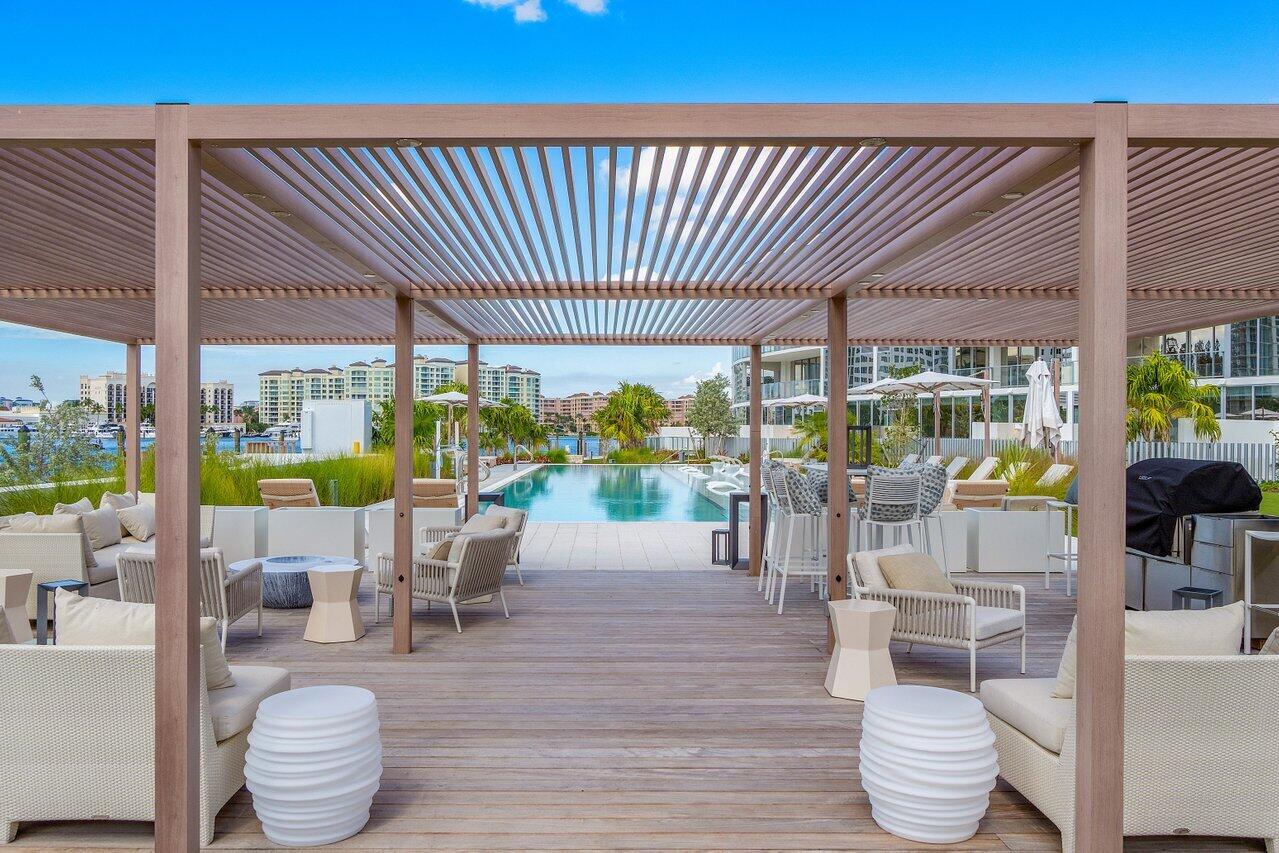 725 South Ocean Boulevard, Unit 202 Boca Raton, FL 33432 - Photo 47 of 57 a outdoor living space with furniture and garden view