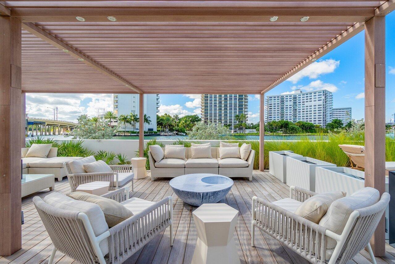 725 South Ocean Boulevard, Unit 202 Boca Raton, FL 33432 - Photo 48 of 57 a outdoor living space with patio furniture and a garden