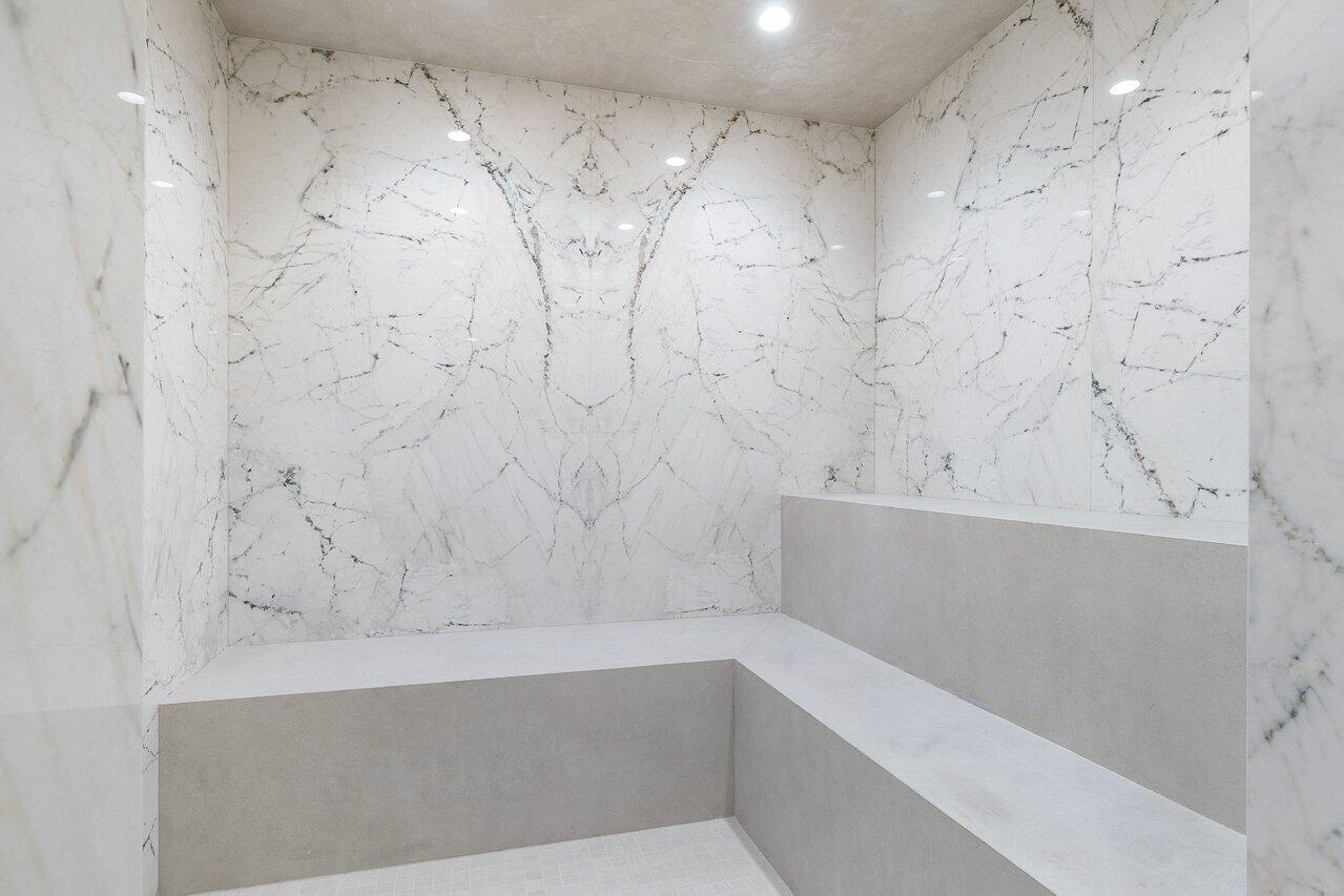 725 South Ocean Boulevard, Unit 202 Boca Raton, FL 33432 - Photo 53 of 57 a bathroom with a bathtub and shower