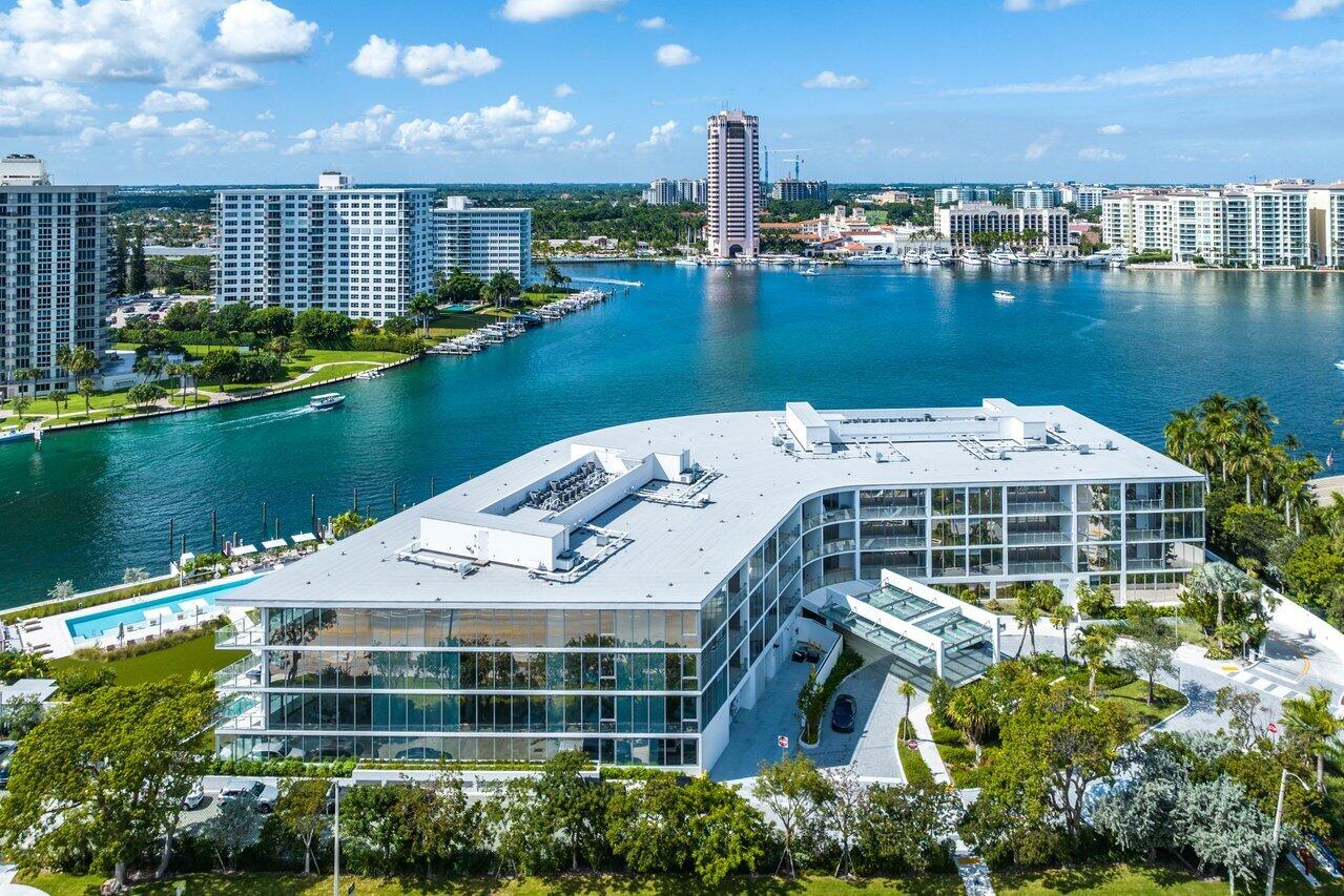 725 South Ocean Boulevard, Unit 202 Boca Raton, FL 33432 - Photo 56 of 57 a view of a lake with a building in the background and lake view