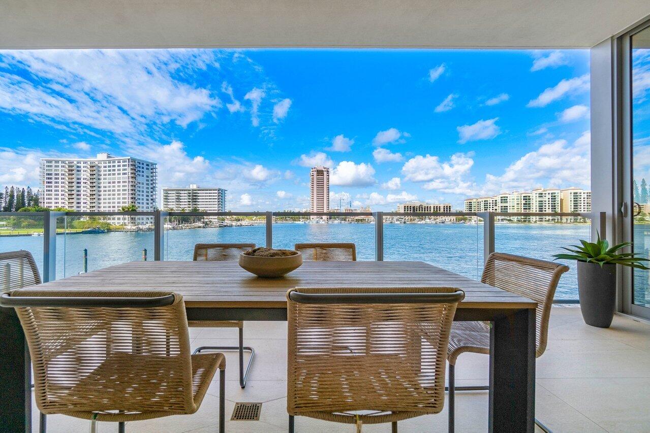 725 South Ocean Boulevard, Unit 202 Boca Raton, FL 33432 - Photo 6 of 57 a view of a patio with a table and chairs