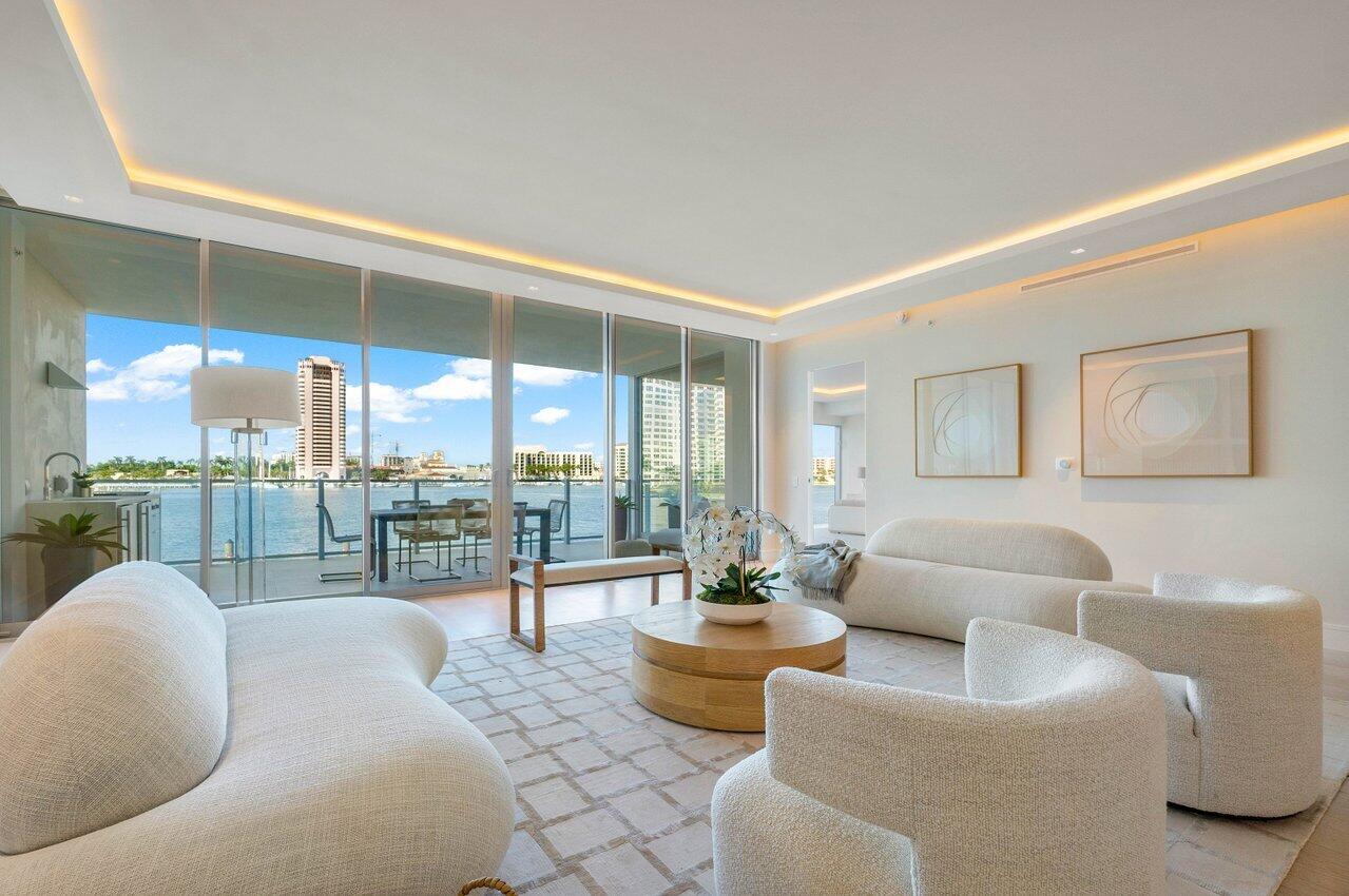 725 South Ocean Boulevard, Unit 202 Boca Raton, FL 33432 - Photo 8 of 57 a living room with furniture and a floor to ceiling window