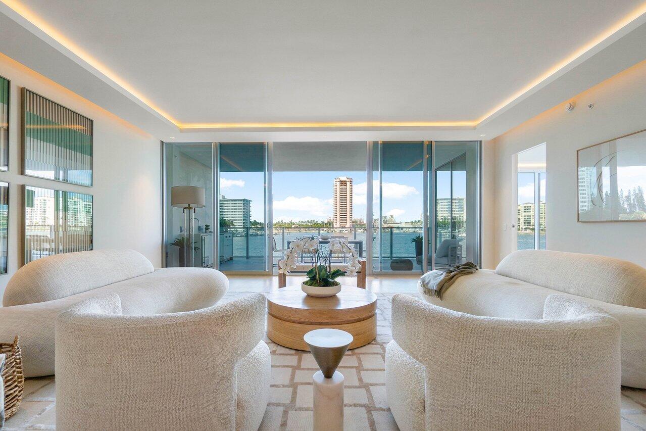 725 South Ocean Boulevard, Unit 202 Boca Raton, FL 33432 - Photo 9 of 57 a living room with furniture and a large window