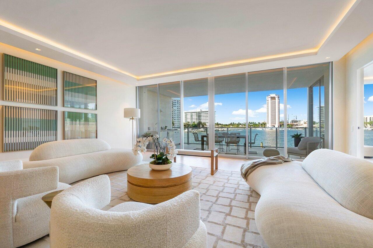 725 South Ocean Boulevard, Unit 202 Boca Raton, FL 33432 - Photo 10 of 57 a living room with furniture and a large window