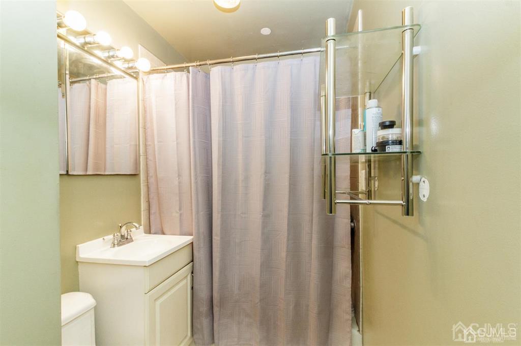 46 Condict Road Landing, NJ 07850 - Photo 8 of 22 a bathroom with a sink a toilet and shower