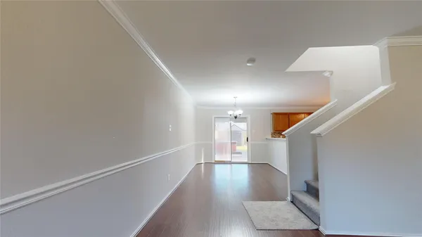 a view of entryway with stairs and wooden floor