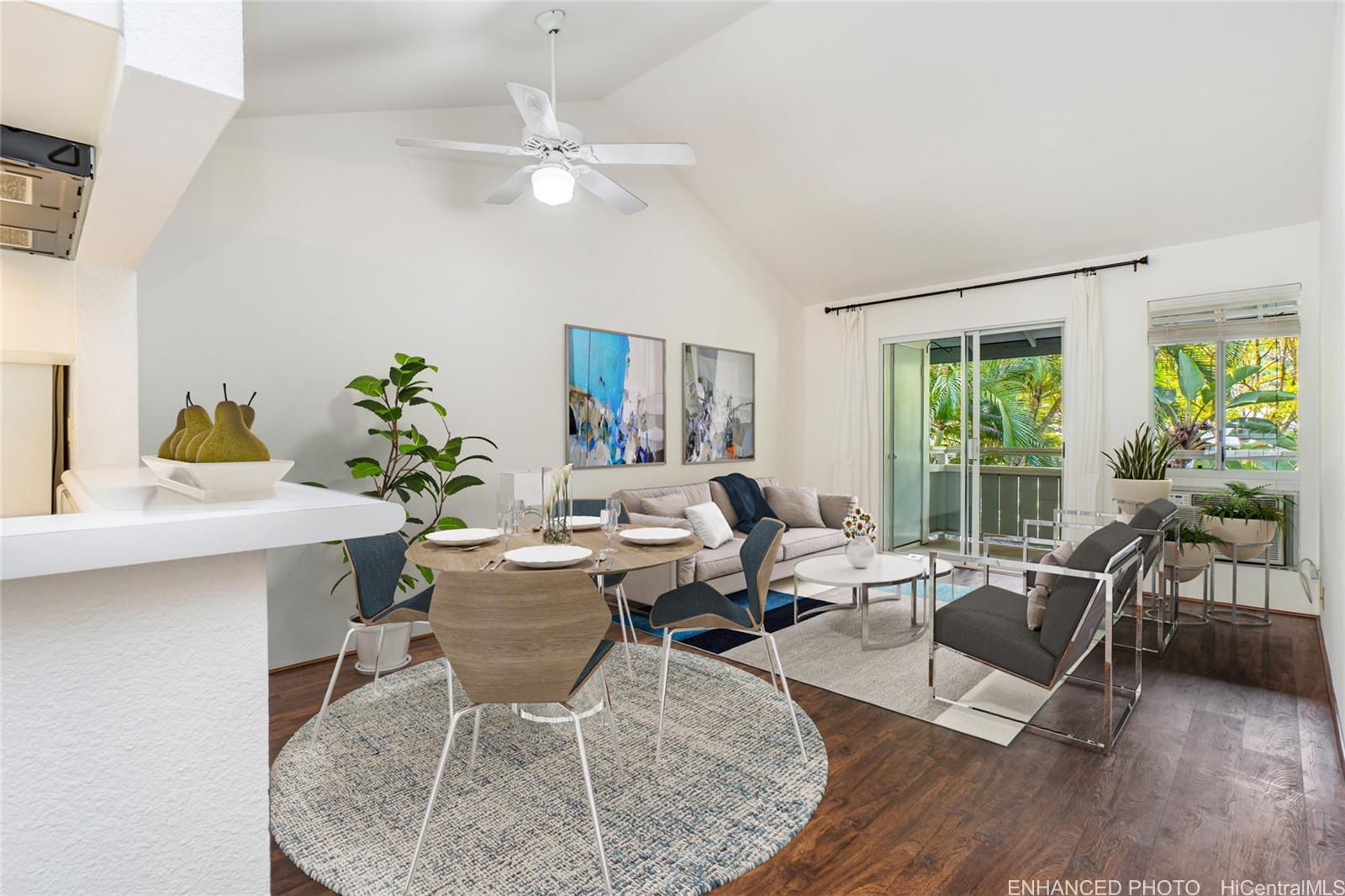 95-802 Wikao Street, Unit R202 Mililani, HI 96789 - Photo 1 of 1 a workspace with furniture and a large window