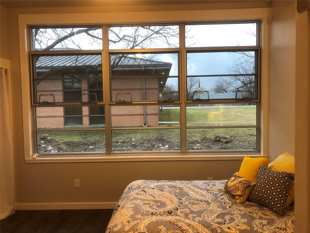 809 Vance Street Taylor, TX 76574 - Photo 7 of 10 a bedroom with a bed and a window