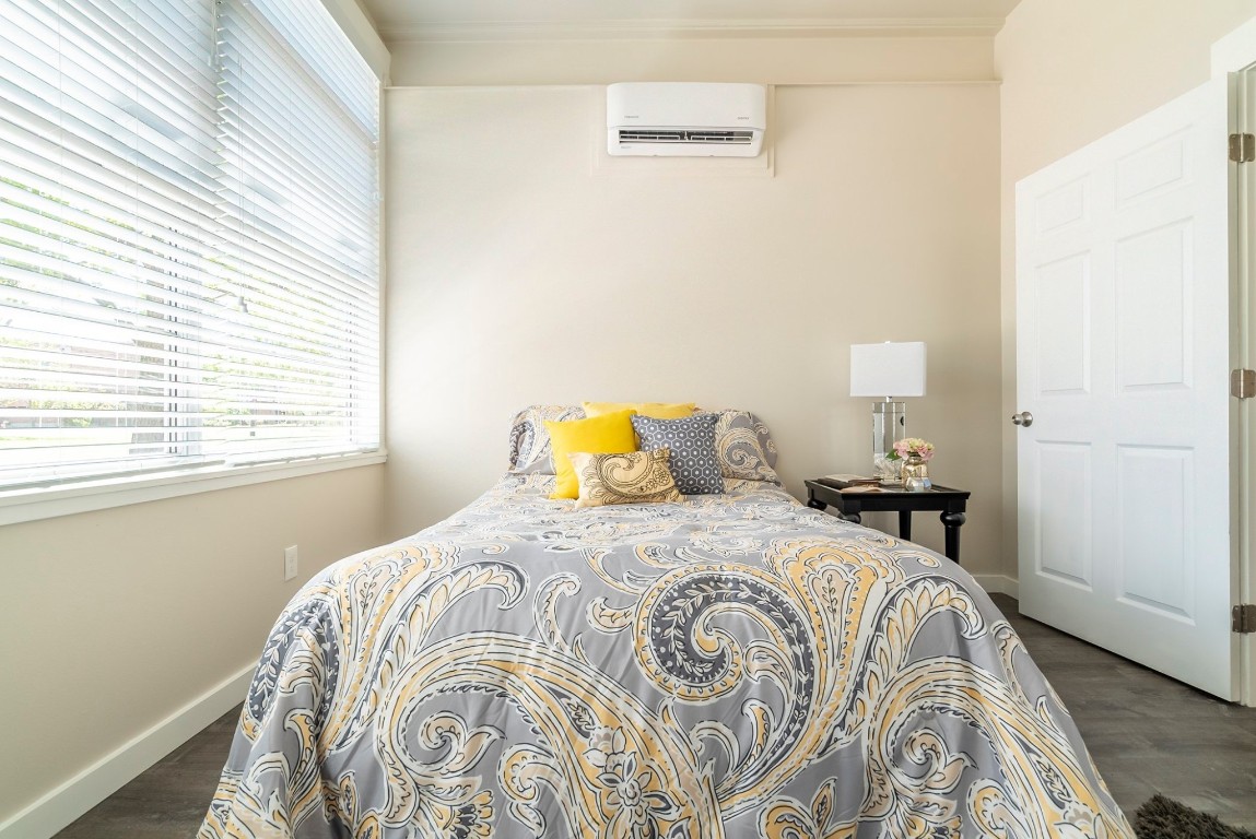 809 Vance Street Taylor, TX 76574 - Photo 8 of 10 a bedroom with a bed and a window