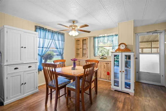 a view of a dining room with furniture window and wooden floor