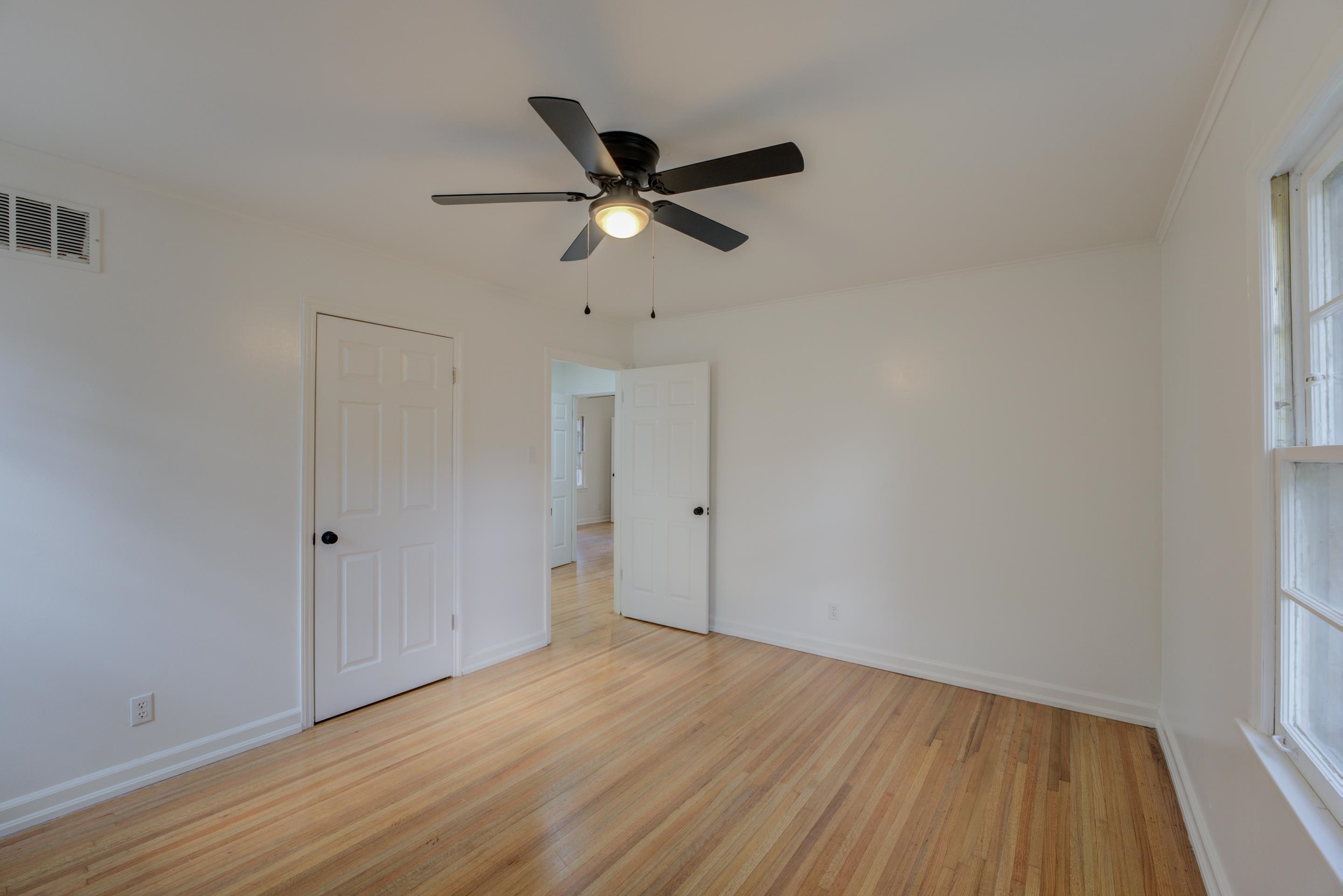 1609 South Perkins Road Memphis, TN 38117 - Photo 11 of 23 a view of empty room with wooden floor
