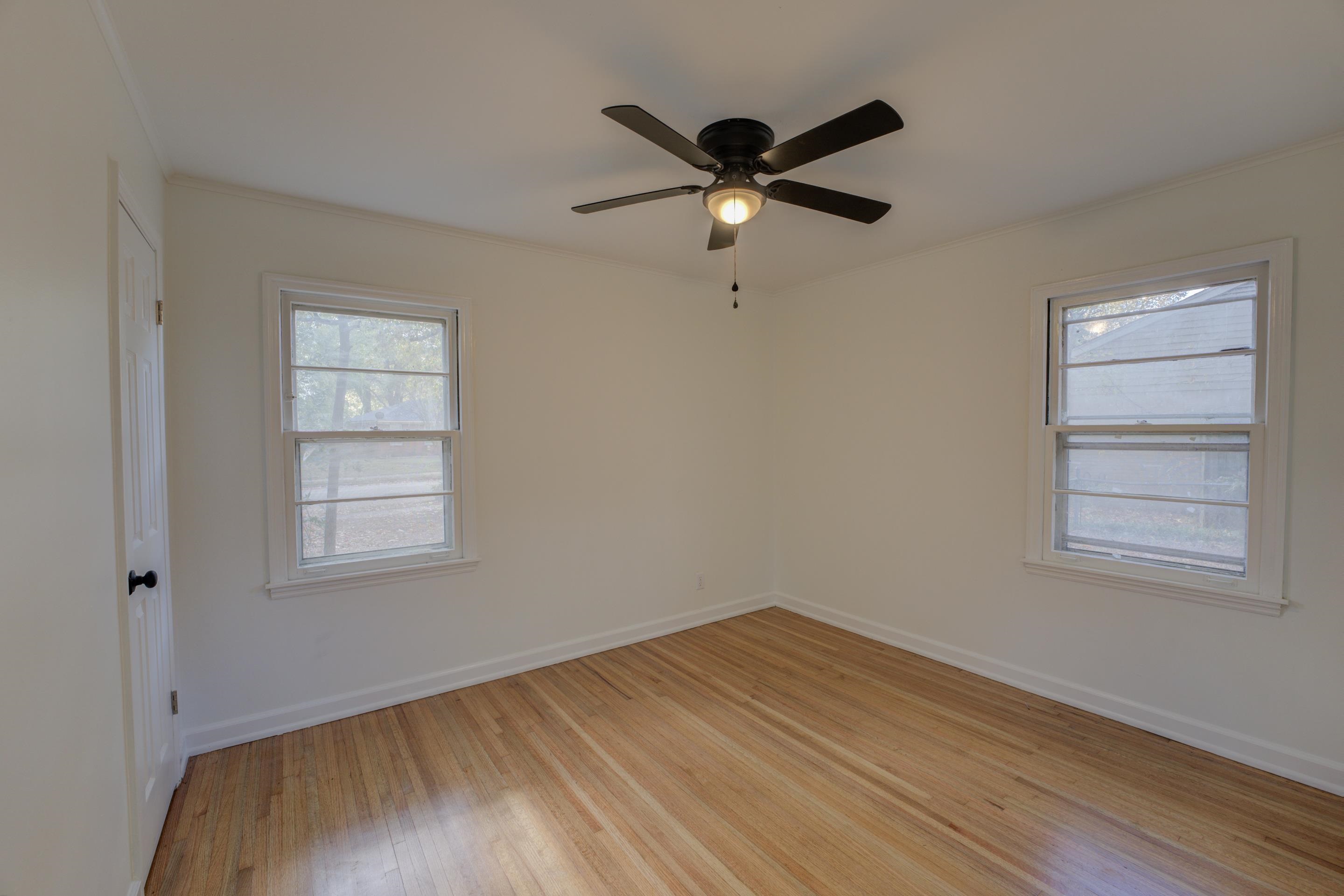 1609 South Perkins Road Memphis, TN 38117 - Photo 15 of 23 a view of empty room with wooden floor and window