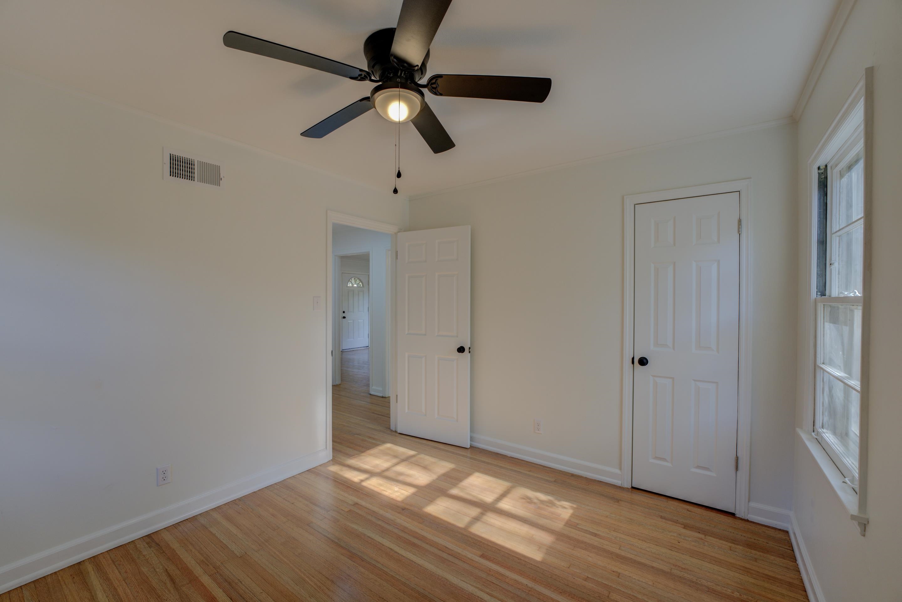 1609 South Perkins Road Memphis, TN 38117 - Photo 16 of 23 a view of an empty room with wooden floor and a window