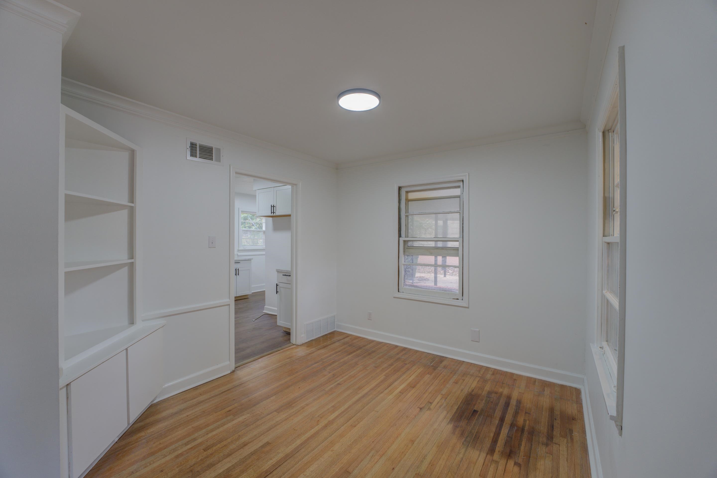 1609 South Perkins Road Memphis, TN 38117 - Photo 20 of 23 a view of empty room with wooden floor and fan