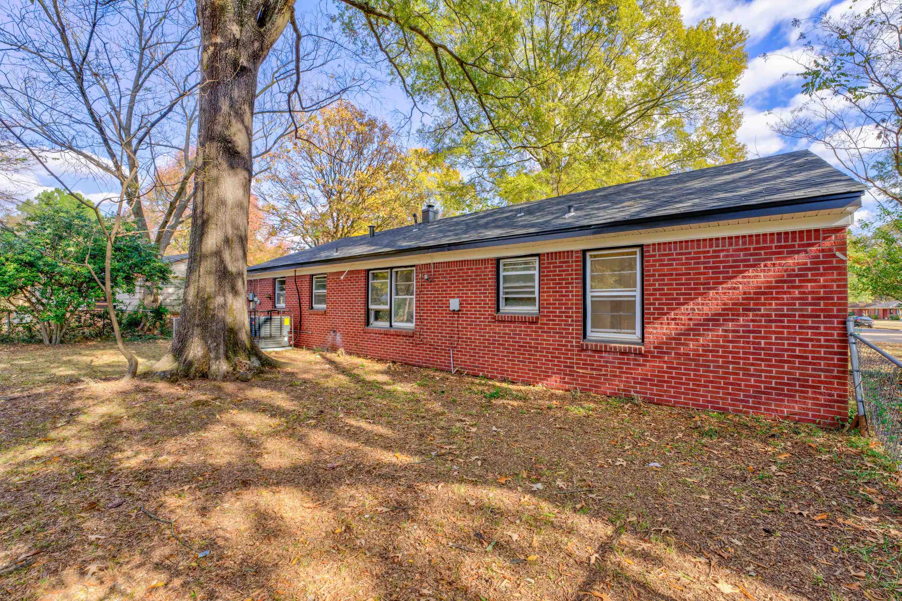 1609 South Perkins Road Memphis, TN 38117 - Photo 23 of 23 a front view of a house with a yard