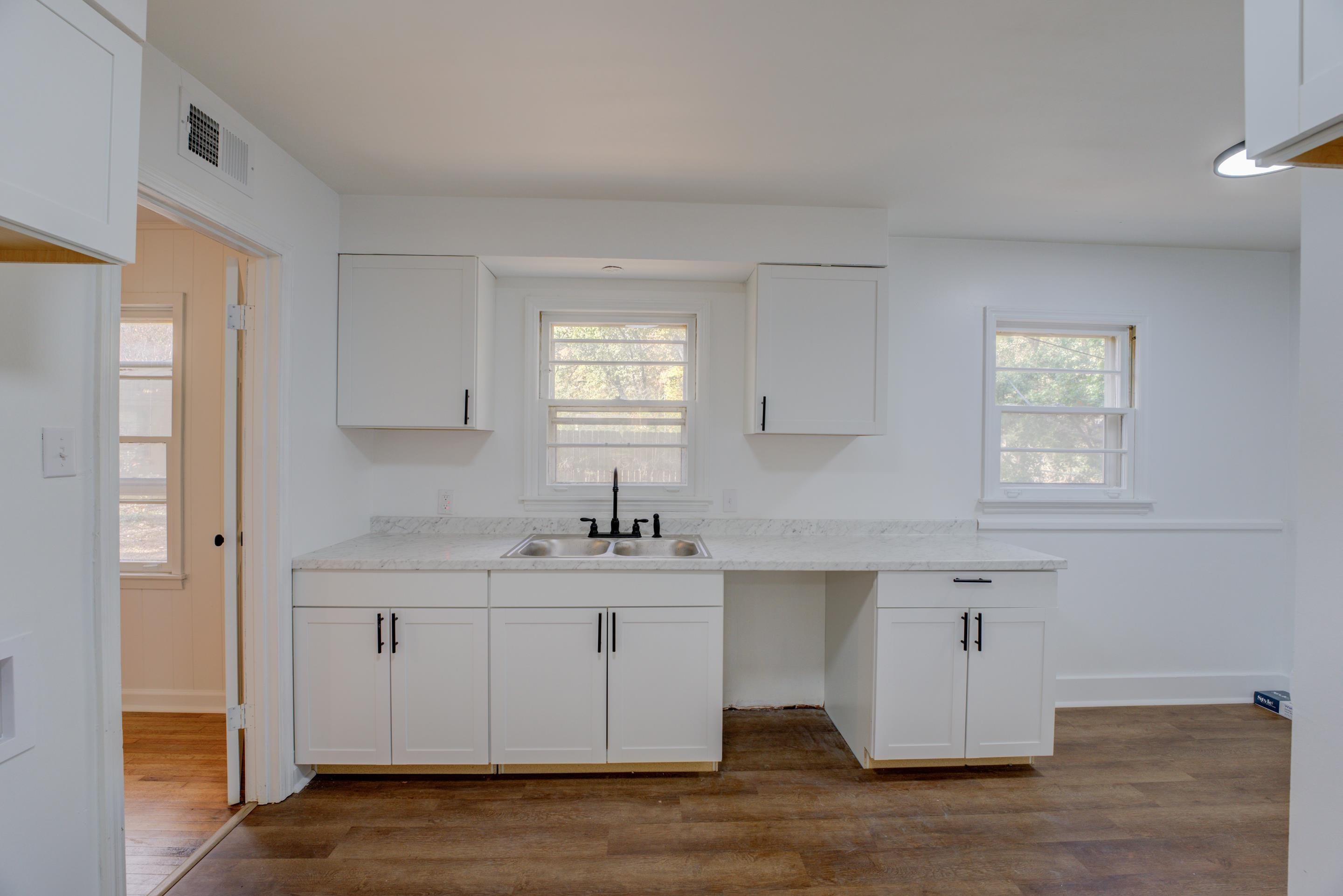 1609 South Perkins Road Memphis, TN 38117 - Photo 8 of 23 a kitchen with stainless steel appliances granite countertop a sink a stove and a window