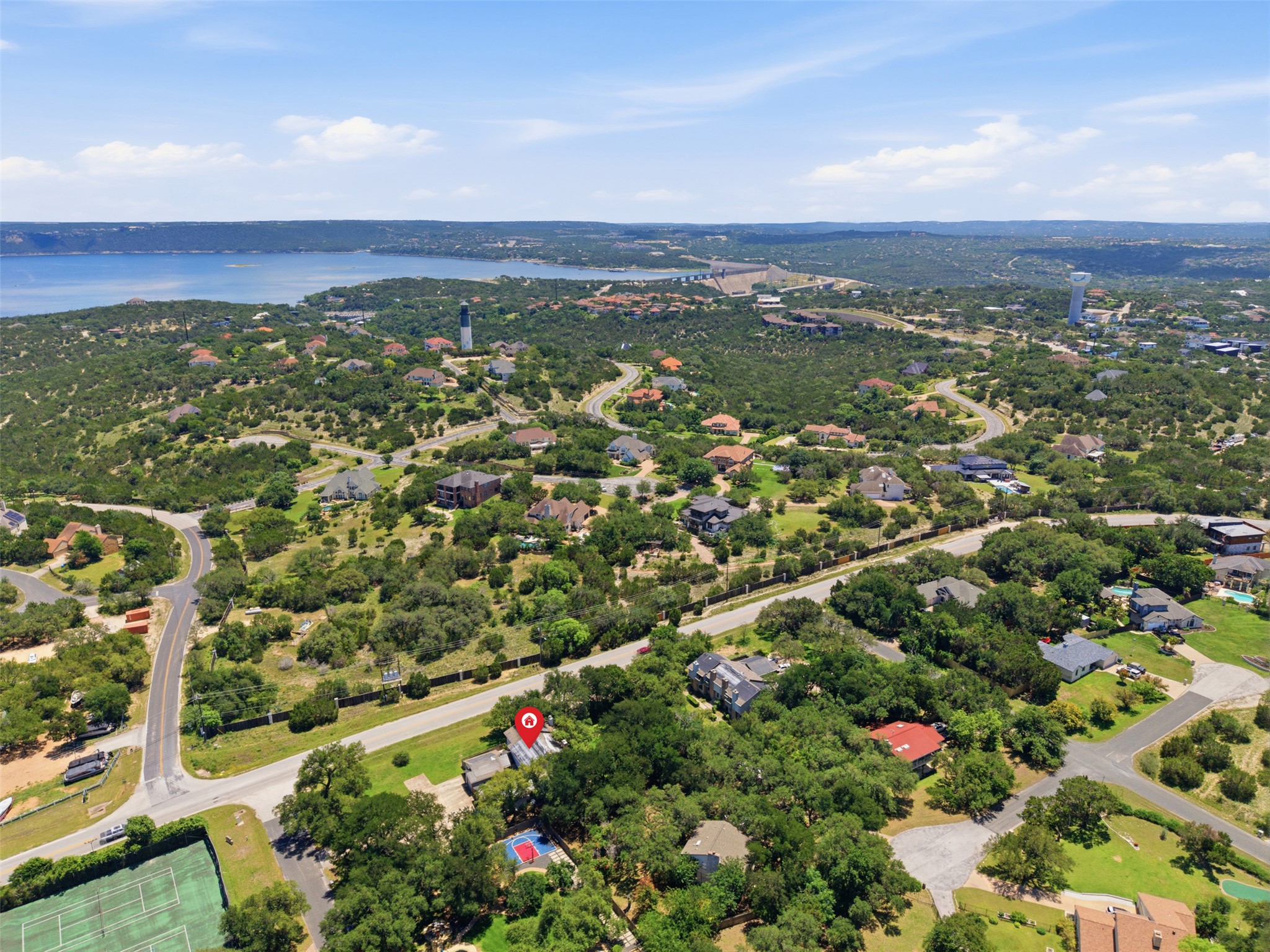 4204 Hudson Bend Road, Unit B Austin, TX 78734 - Photo 35 of 37 Aerial perspective of a verdant landscape featuring a prominent body of water and scattered residential properties