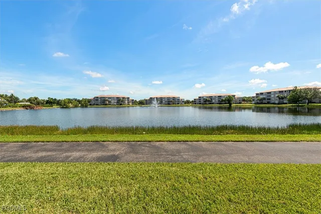 a view of a lake with houses in the back